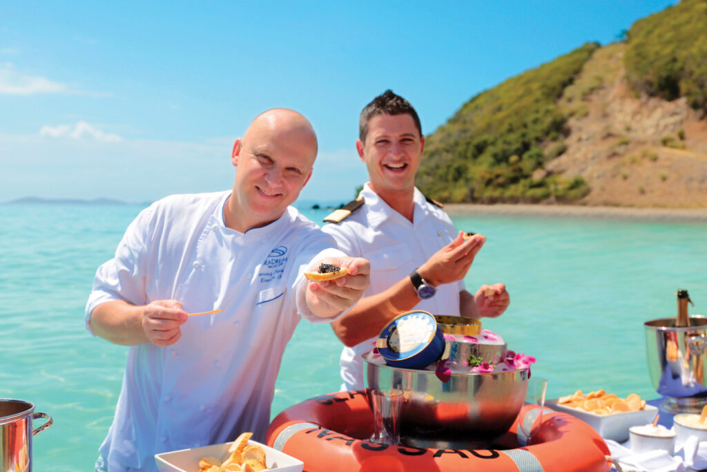 SeaDream Yacht charters include champagne and caviar served in the Caribbean surf